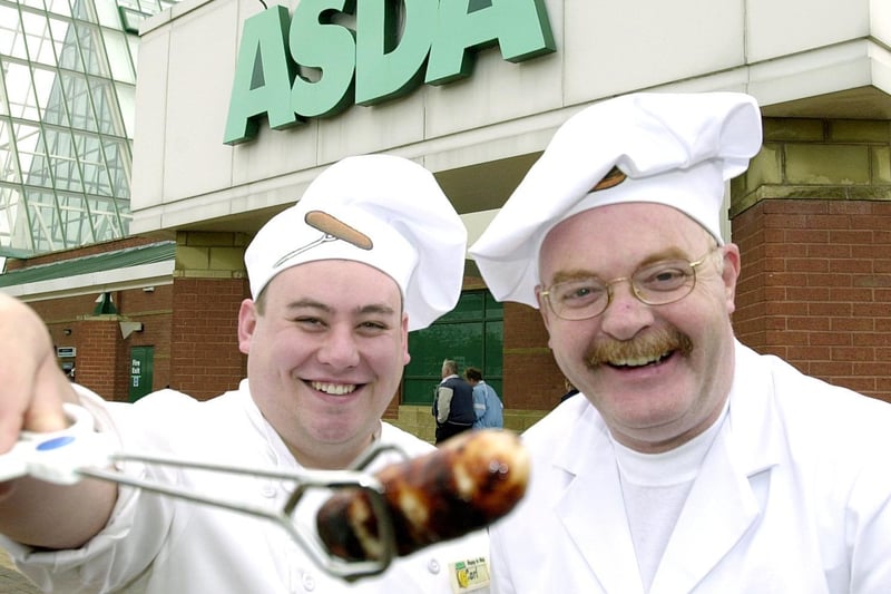 May 2000 and Asda workers Carl Walker, (left) (Deli assistant) and Steve Close cooked burgers and sausages in a world record attempt for the World's Biggest BBQ at the Owlcotes Centre store.