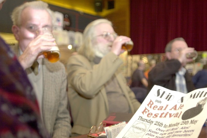 Drinkers sup their pints at the annual Leeds Beer Cider & Perry Festival held at Pudsey Civic Hall in March 2000.