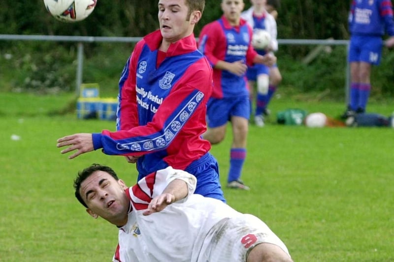 October 2002 and Rothwell Town's Matthew Pitts tackles John Fothergill of Swillington during the Leeds Combination League clash.