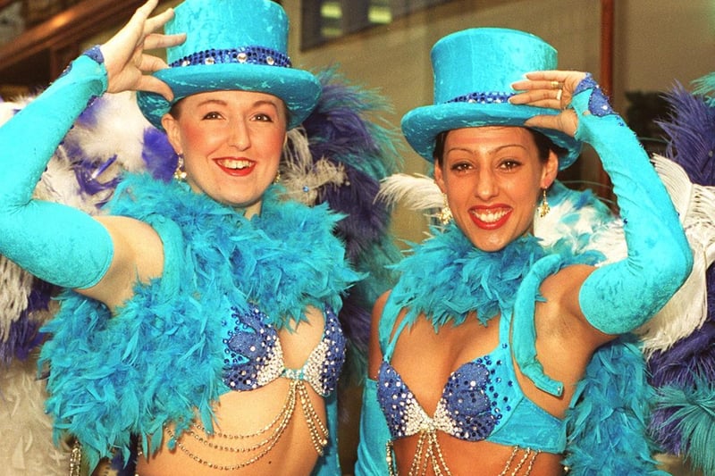 Showgirls Lucy Lloyd (left) and Naomi Carlisle show off two of the colourful costumes from C'est Magnifique, being staged at the City Varieties.