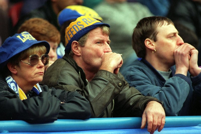 Dejected Leeds RL fans watch as the team were beaten 28-6 against Bradford Bulls in the semi final of the Challenge Cup at Huddersfield's McAlpine Stadium.