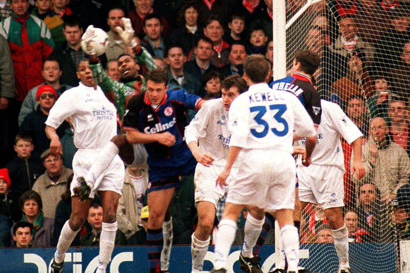 Make-shift goalkeeper Lucas Radebe collects the ball from a Middlesbrough cross.