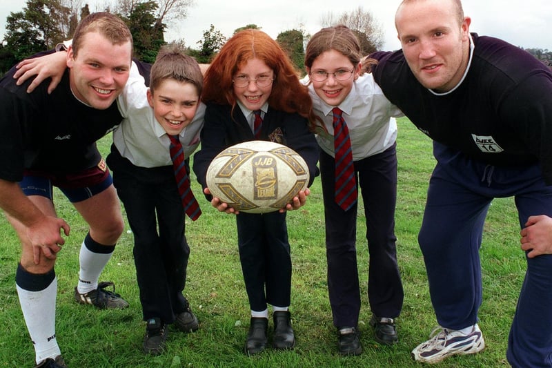 Castleford Tigers stars Ian Tonks (left ) and Nathan Sykes of Castleford Tigers stopped off at Garforth Community College to give rugby coaching tips to students. Picured is Robert Scott, Zoe Sharp, and Danielle Scales.
