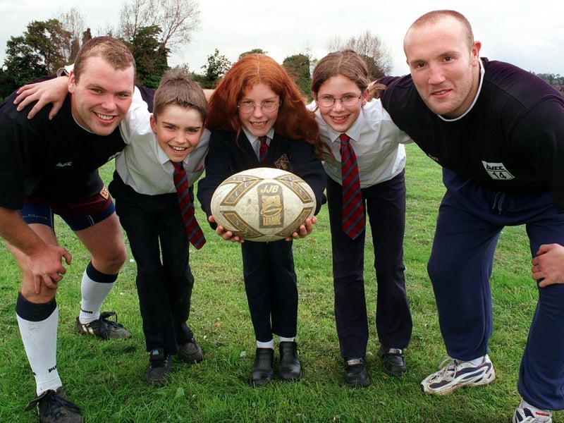 Castleford Tigers stars Ian Tonks (left ) and Nathan Sykes of Castleford Tigers stopped off at Garforth Community College to give rugby coaching tips to students. Picured is Robert Scott, Zoe Sharp, and Danielle Scales.