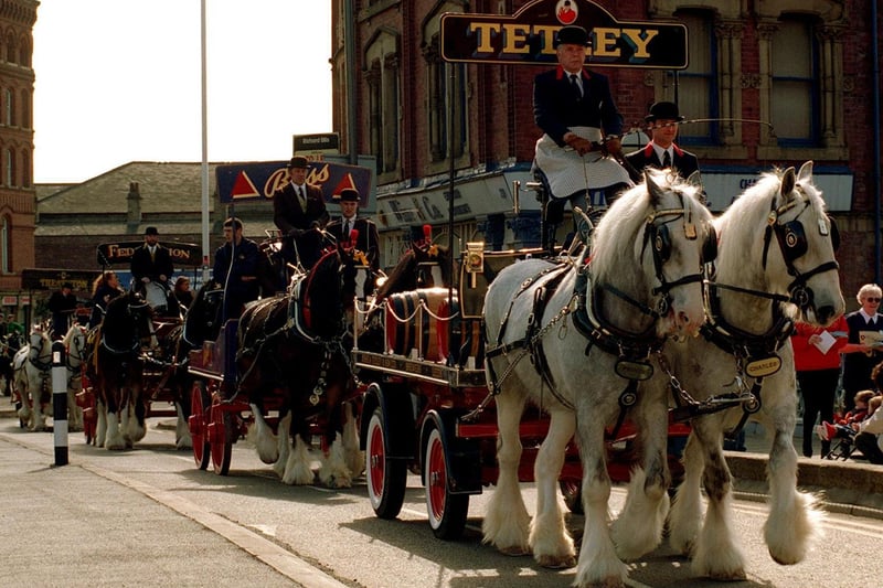 Celebrating the third anniversary of the opening of Tetley's Brewery Wharf, a parade of seven brewers drays paraded through the city in March 1997.