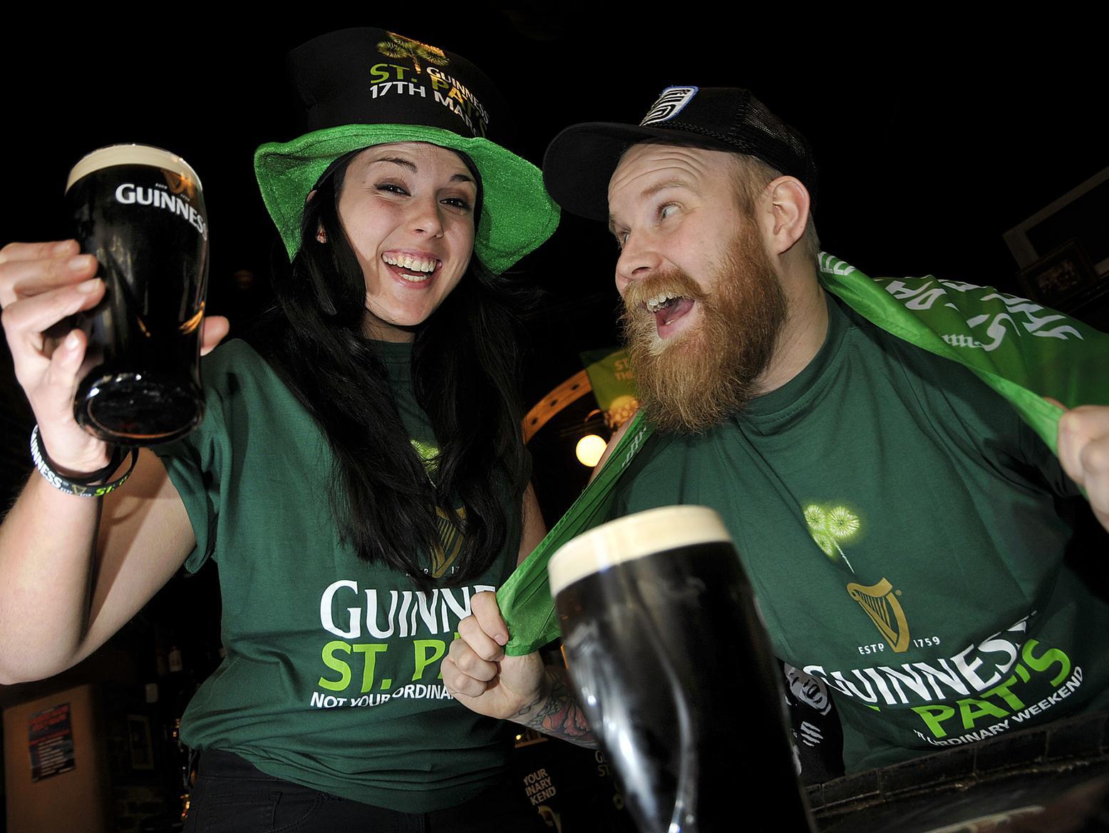Merchant pub staff members Alice Barrand and Chris Mayes enjoy a tipple to celebrate the big day in 2014.