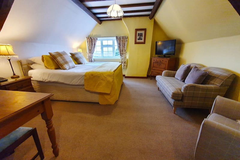 Another of the hotel's large bedrooms, with exposed beams on the ceiling.