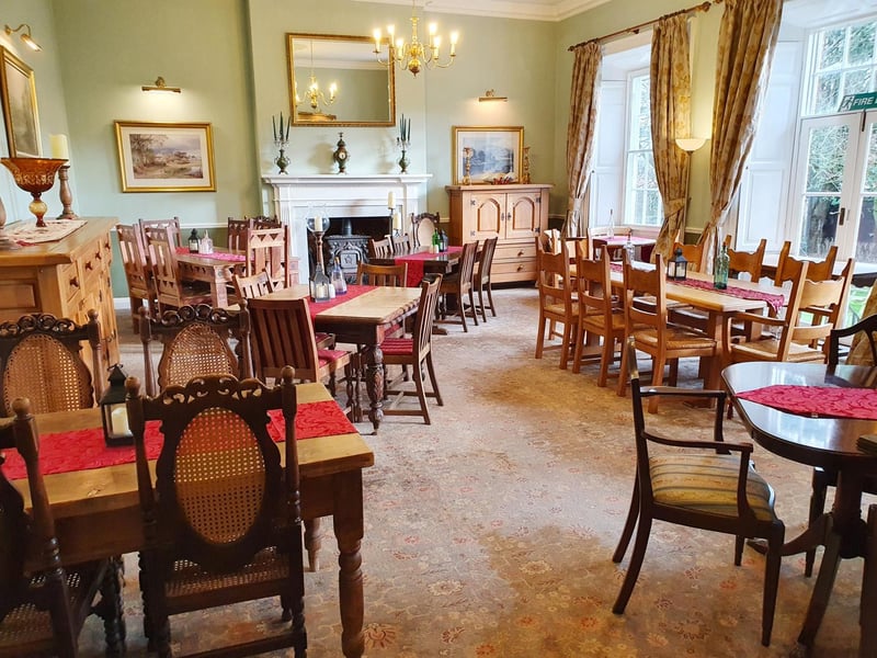 The opulent setting of the dining room, where guests can enjoy their meals.
