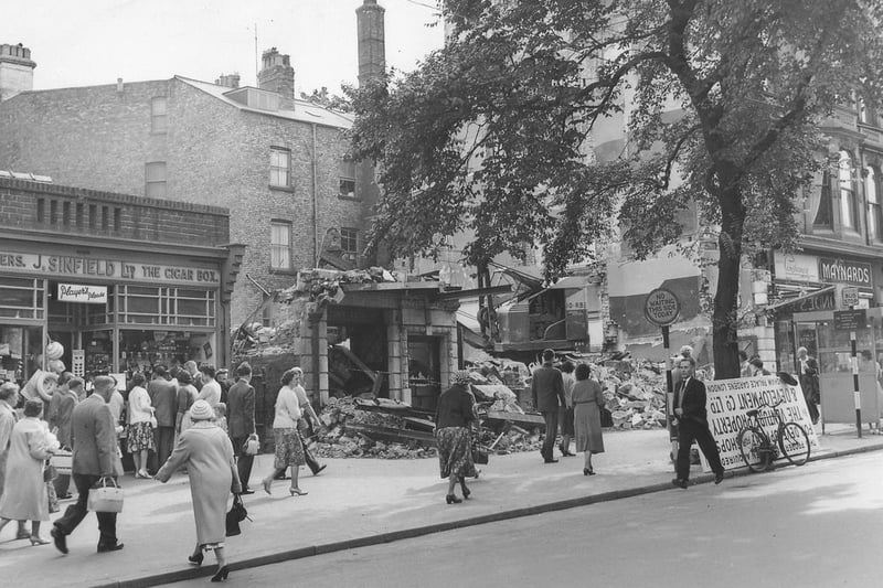 Demolition of the Londesborough cinema in 1960. In the photo, a crowd of people have found something of interest in the window of Sinfield confectioners and tobacconist.