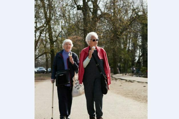 Two ladies enjoying a brisk walk and an ice cream