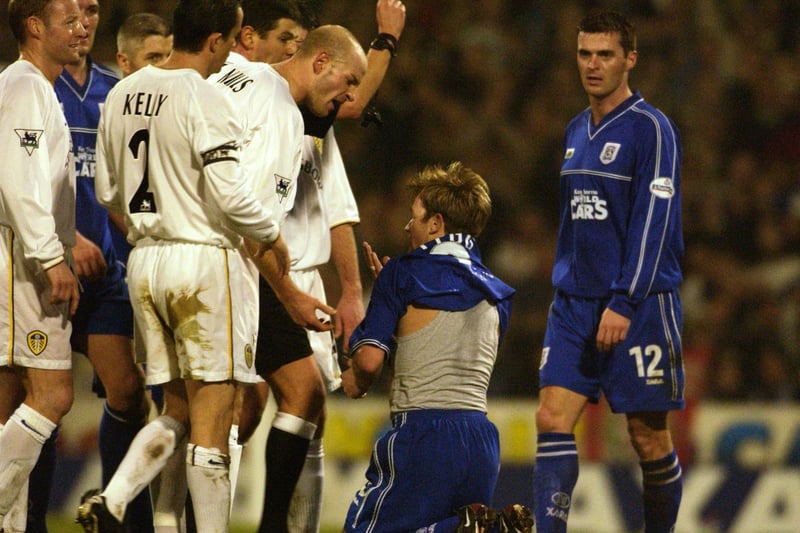 Danny Mills is the first to show his disgust at Cardiff City's Andy Legg after Alan Smith was shown the red card during the FA Cup third round clash at Ninian Park in January 2002.