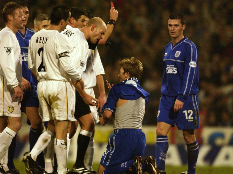 Danny Mills is the first to show his disgust at Cardiff City's Andy Legg after Alan Smith was shown the red card during the FA Cup third round clash at Ninian Park in January 2002.