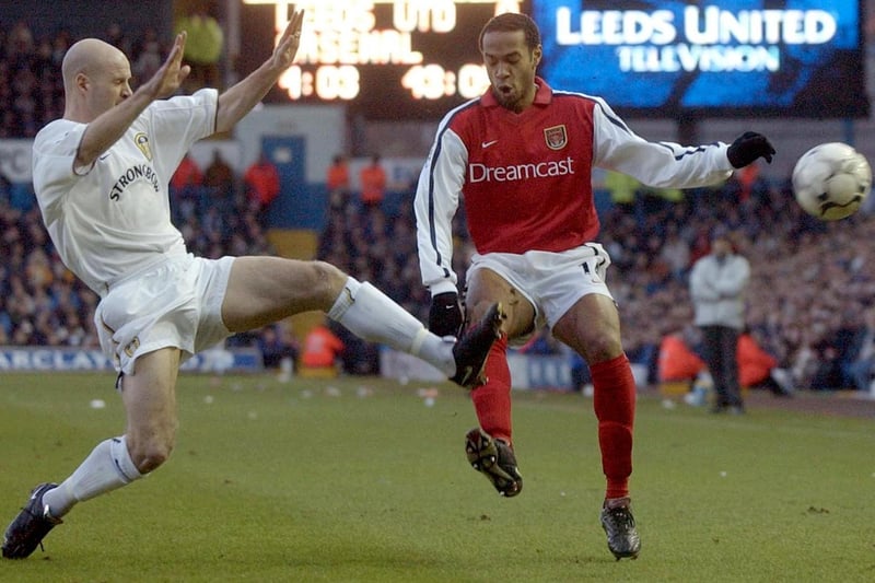 Danny Mills goes toe to toe with Arsenal's Thierry Henry during the Premiership clash at Elland Road in January 2002. The game finished 1-1 with Robbie Fowler scoring for the Whites.