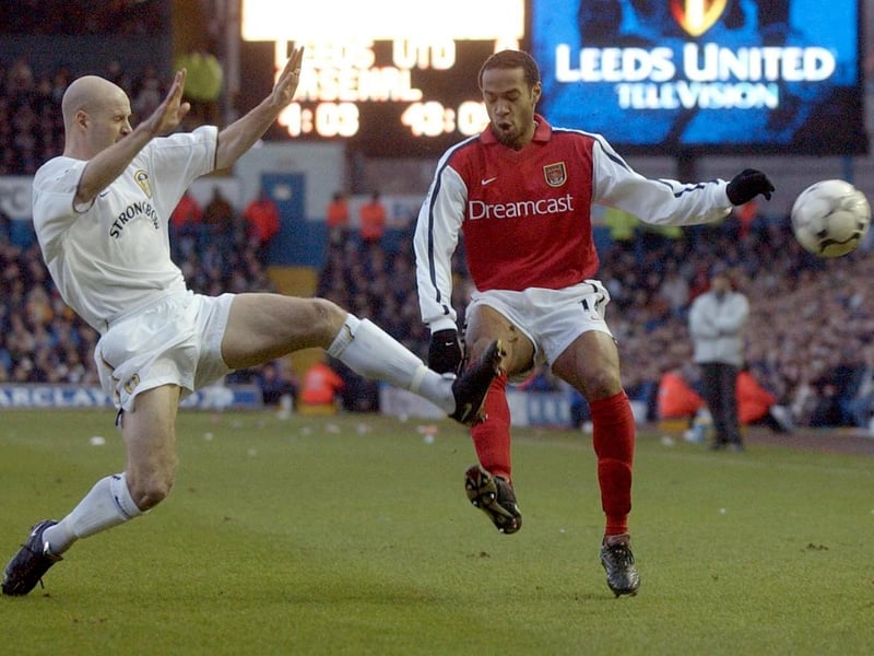 Danny Mills goes toe to toe with Arsenal's Thierry Henry during the Premiership clash at Elland Road in January 2002. The game finished 1-1 with Robbie Fowler scoring for the Whites.