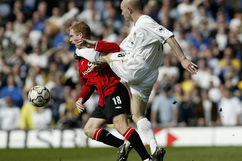 Danny Mills's boot catches Manchester United's Paul Scholes in the throat during the Premiership clash at Elland Road in March 2002. The Red Devils won 4-3.