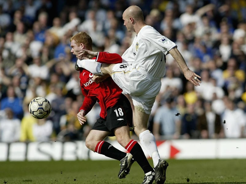 Danny Mills's boot catches Manchester United's Paul Scholes in the throat during the Premiership clash at Elland Road in March 2002. The Red Devils won 4-3.