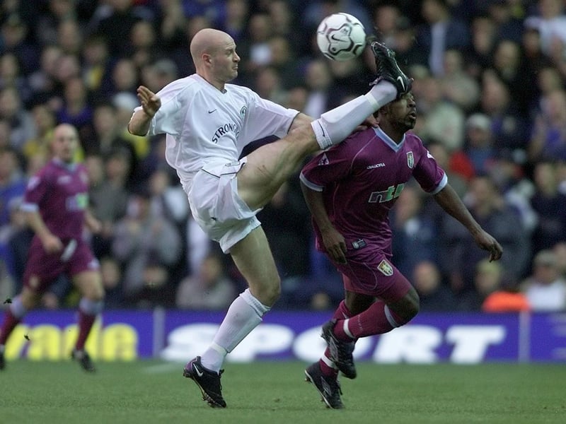 Danny Mills hits the ball past Aston Villa's Darius Vassell during the Premiership clash at Elland Road in November 2001.