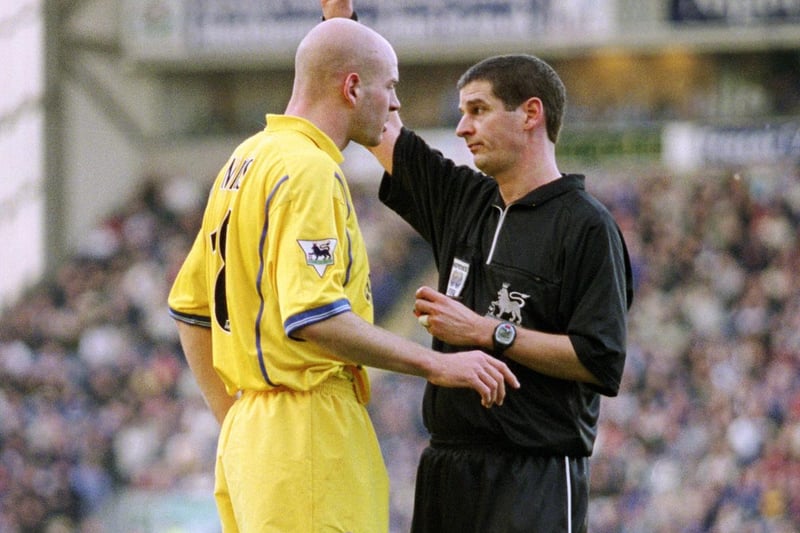 Danny Mills receives a yellow card from referee Andy D'Urso during Leeds United's Premiership clash against Blackburn Rovers at Ewood Park in December 2001. The Whites won 2-1.