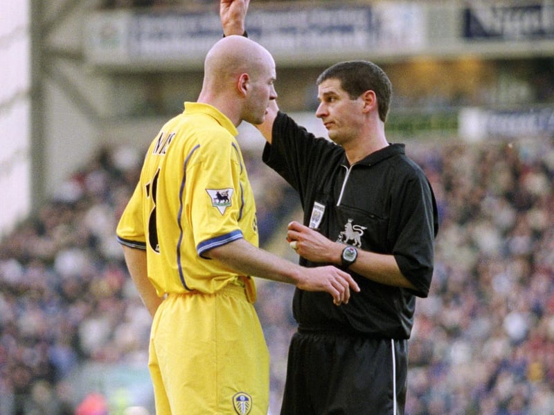 Danny Mills receives a yellow card from referee Andy D'Urso during Leeds United's Premiership clash against Blackburn Rovers at Ewood Park in December 2001. The Whites won 2-1.
