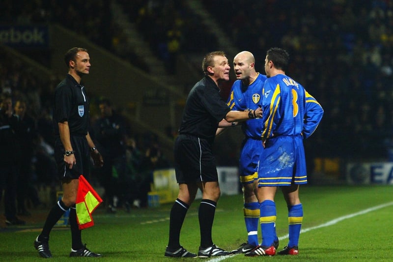 Danny Mills argues with referee Graham Poll during the Premiership clash against Bolton Wanderers in December 2002. He scored in a 3-0 win.