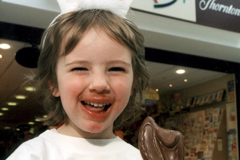 Lucy Collins tucks into a chocolate treat in the shape of Jasper, the Easter Bunny from Thorntons, 2001