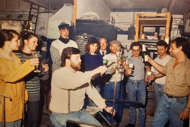 Glasform, May 1990. Designer John Ditchfield pours the champagne as staff celebrate TV success