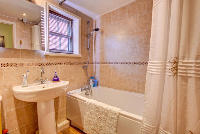 The property's bathroom includes both bath and shower, and is fully tiled.