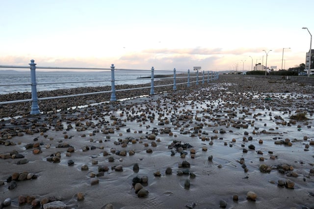 Storm surge aftermath 2014. Pebbles from the beach strewn across the prom opposite Morecambe Town Hall.