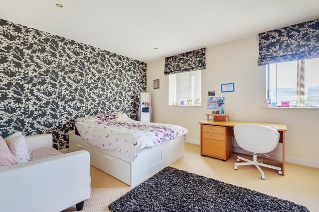 This double bedroom has the space for a large armchair and study facilities.