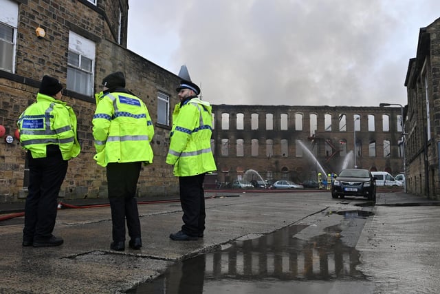 Police have cordoned off an area while fire crews worked at the scene