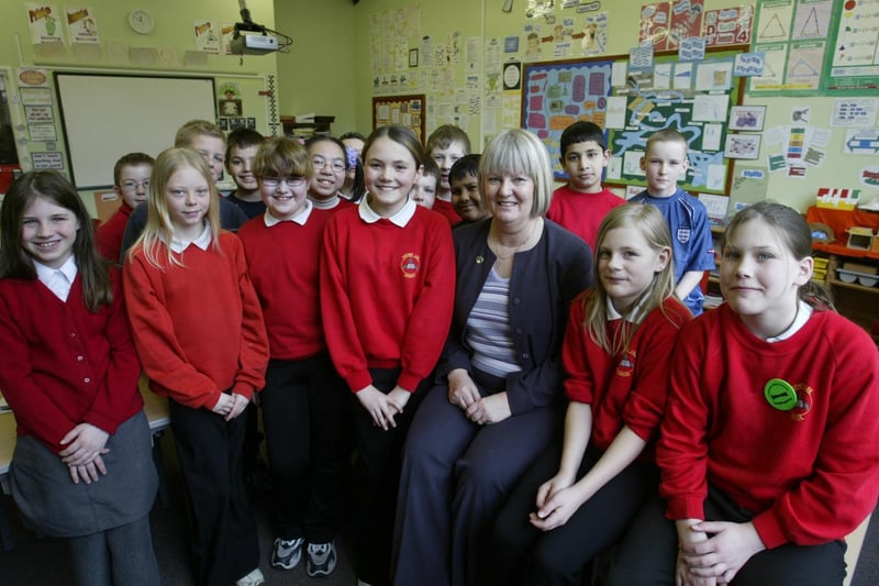 Sue Ellis retiring head teacher at Ferney Lee School, Todmorden with some of her pupils.