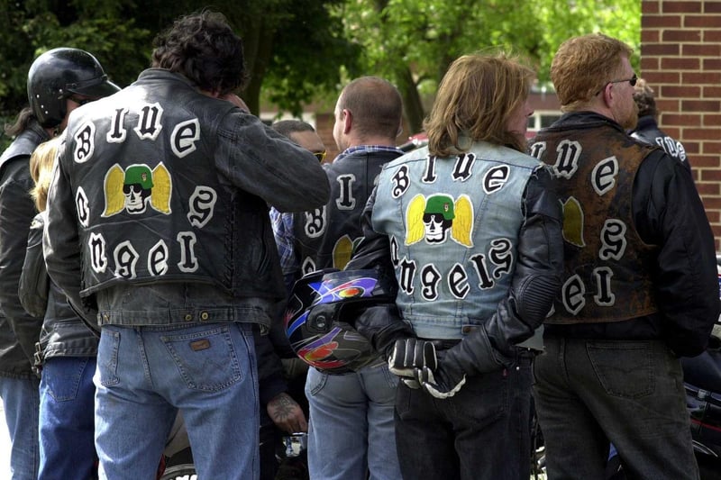 Members of the Blue Angels wait outside St Theresa's Church in Cross Gates during the funeral service of their friend and fellow biker Stephen Mooney in May 2000.