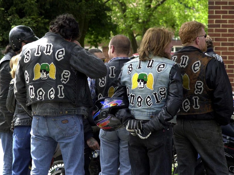 Members of the Blue Angels wait outside St Theresa's Church in Cross Gates during the funeral service of their friend and fellow biker Stephen Mooney in May 2000.
