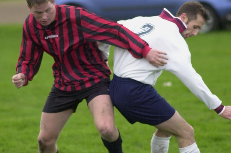 Match action from Whinmoor's clash with Queenshill in Division Senior A of the Leeds Sunday League. Pictured Danny Furness (left) battles for the ball with Whinmoor's Roger Henderson.
