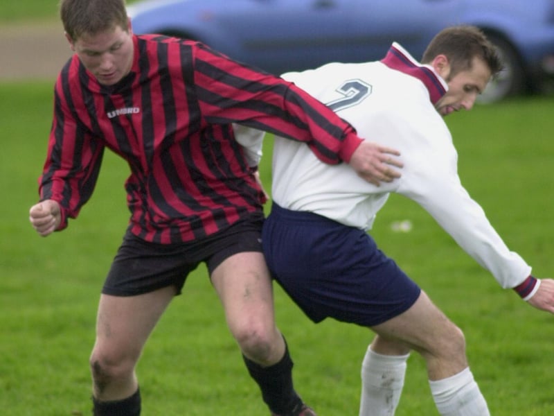 Match action from Whinmoor's clash with Queenshill in Division Senior A of the Leeds Sunday League. Pictured Danny Furness (left) battles for the ball with Whinmoor's Roger Henderson.