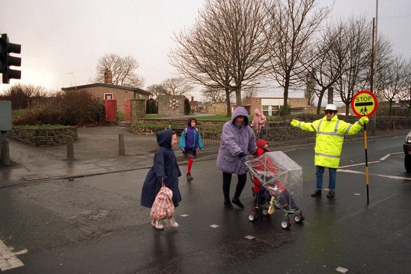 February 1997 and lollipop lady Carol Archibald patrols the pelican crossing outside Westfield Primary School on New Road.