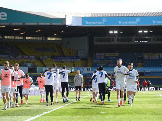 TRIBUTE: Marcelo Bielsa's Whites warm up prior to the home clash against Sheffield United earlier this month and pay their respects to club legend Peter Lorimer. Photo by LAURENCE GRIFFITHS/POOL/AFP via Getty Images.