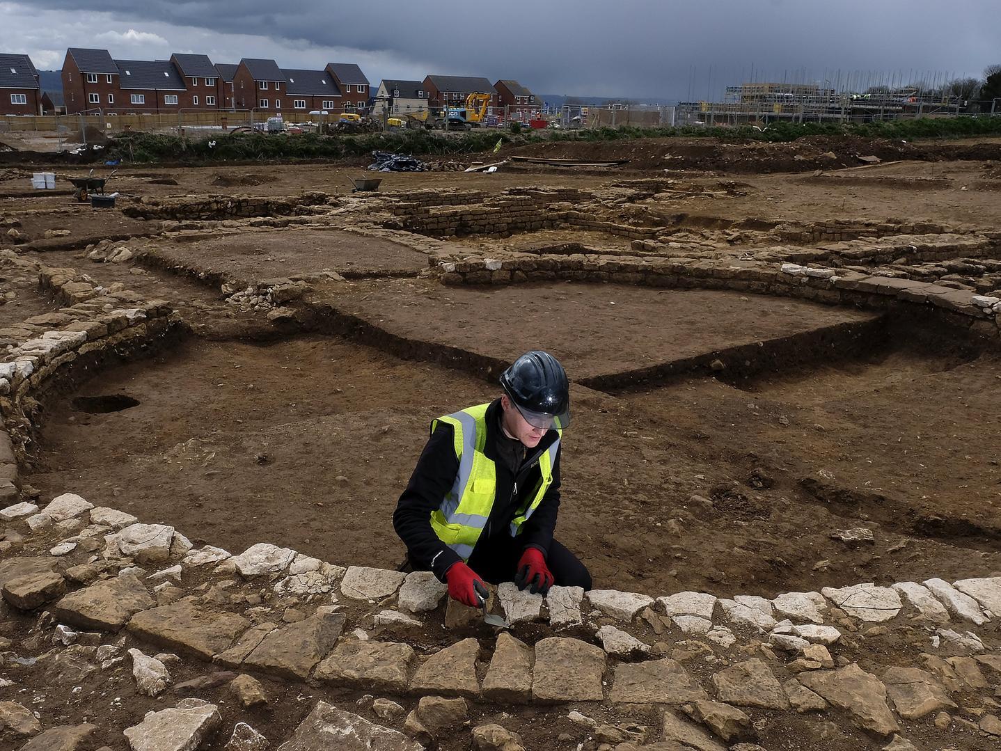 Trainee Field Archaeologist Corey Greening works on the site.