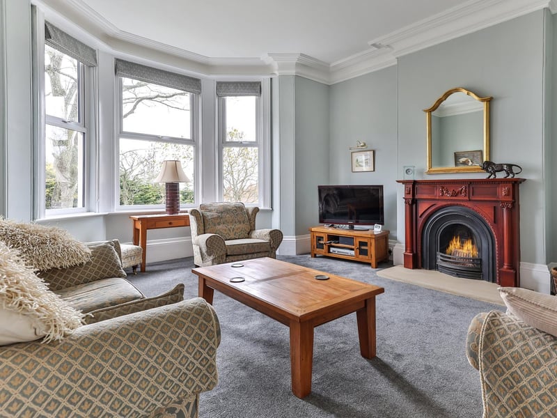 A large bay window makes this room light and bright