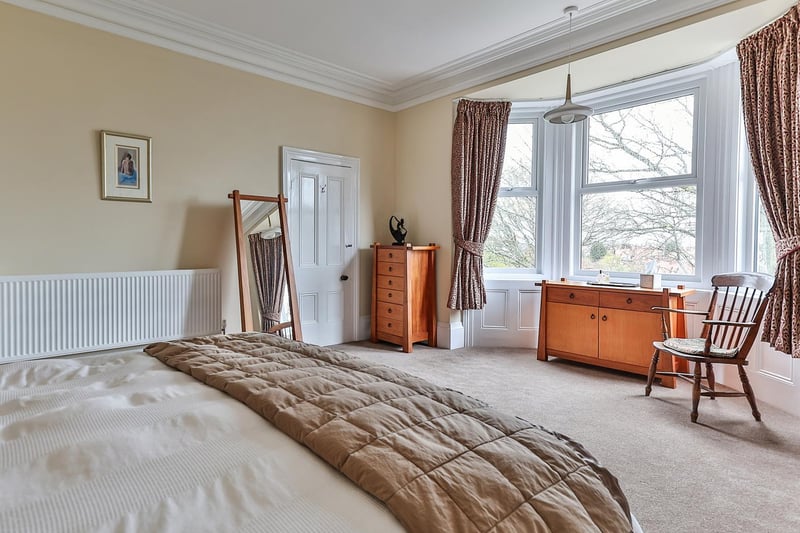 A lovely big bedroom with bay window within the property