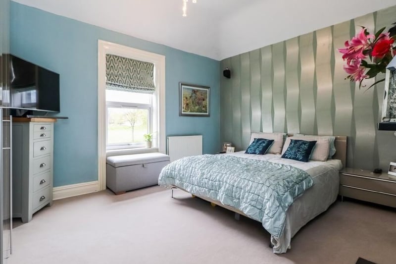 One of the spacious bedrooms within the property on Bradford Road