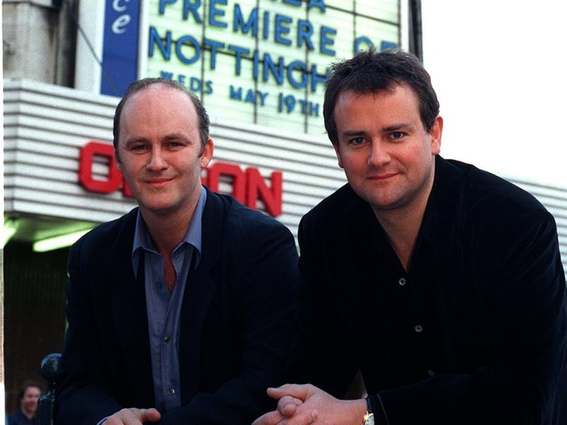 Two of the stars of Notting Hill - Tim McInnerny (left) and Hugh Bonneville - arrive at the Odeon cinema on The Headrow for the film's gala premiere.
