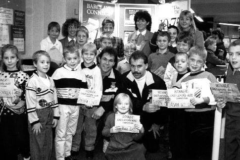 A press photograph of the winners of a children's design competition organised by Barclays Bank in Castleford, the Australian players Ron Gibbs and Steve Larder from Castleford RLFC are in the centre