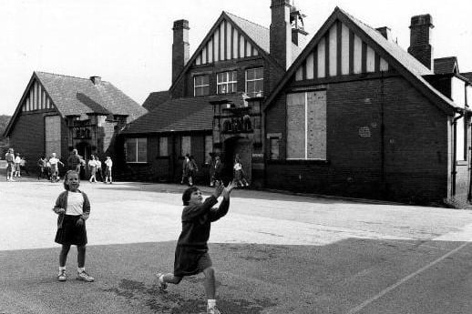 A press photograph of children playing at Castleford Park Middle School