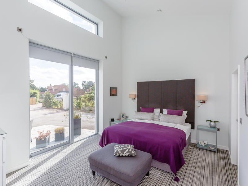 Natural light floods in to rooms within the house through large windows