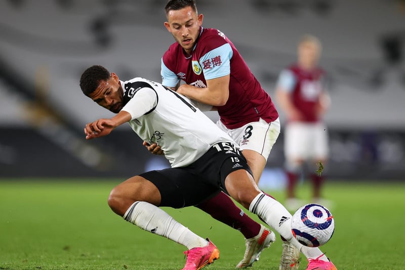 Ruben Loftus-Cheek of Fulham battles for possession with Josh Brownhill of Burnley during the Premier League match between Fulham and Burnley at Craven Cottage on May 10, 2021 in London, England.
