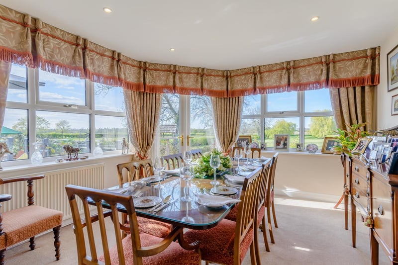 The dining room has French doors opening onto the terrace and garden.