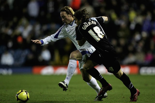 Luciano Becchio holds off Northampton Town's Ryan Gilligan during the FA Cup first round clash at Elland Road in November 2008.