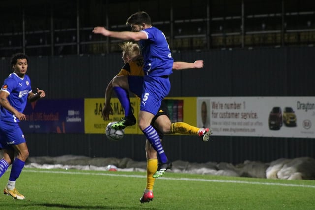 Will Evans deals with ex-Chesterfield academy youngster Jordan Burrow. Photo: Oliver Atkin