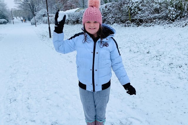 Amelia, 12, making snowballs in MK. By Danielle King